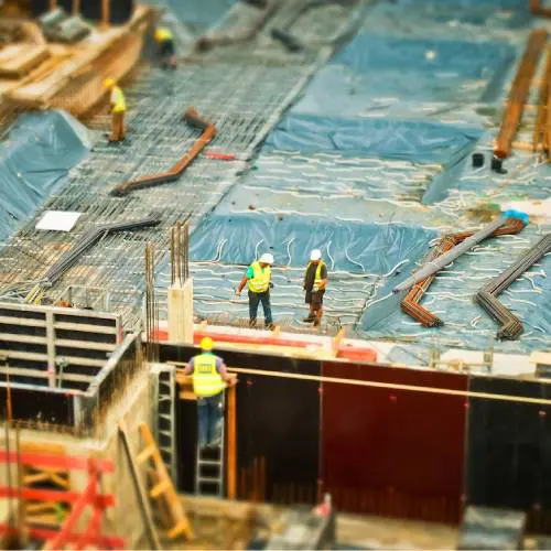 Construction workers on a building site.