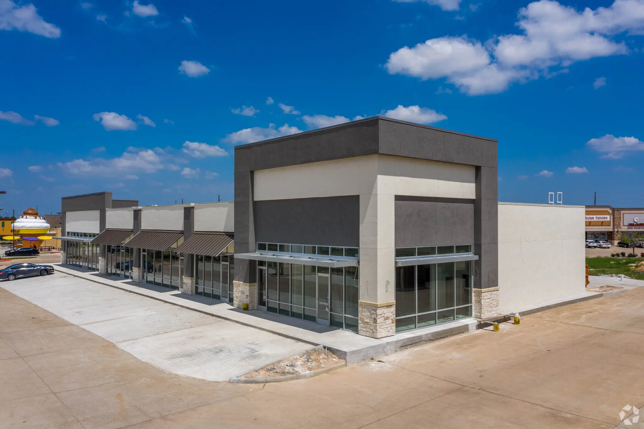 Vacant modern retail strip mall building