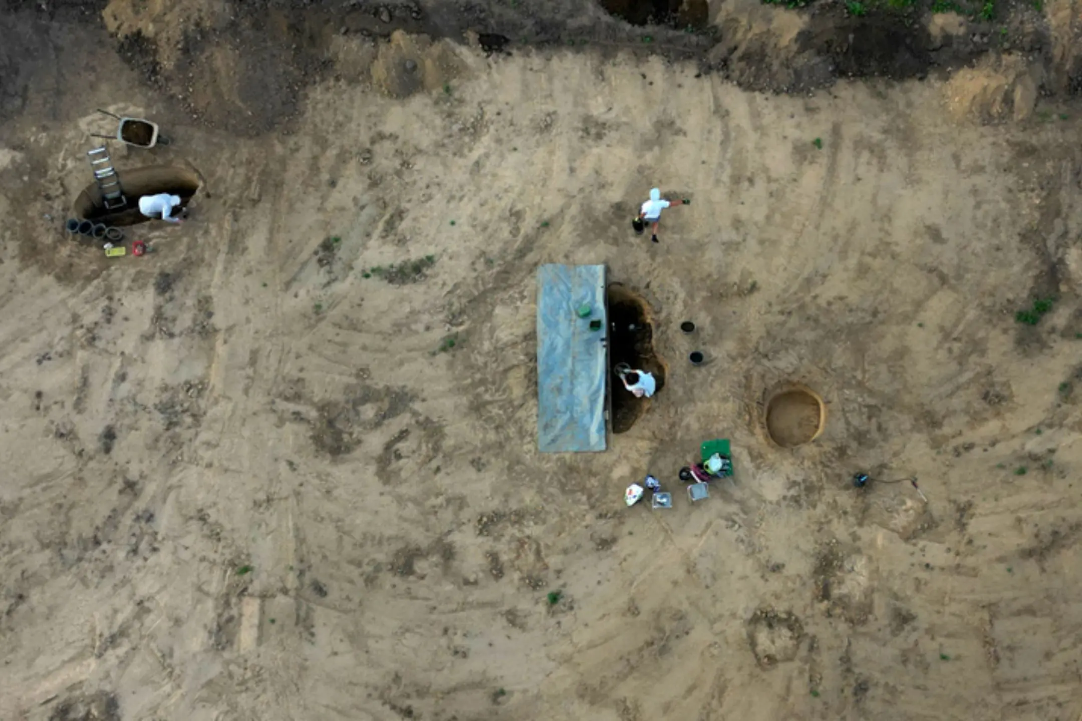 Aerial view of excavation team at sandy site