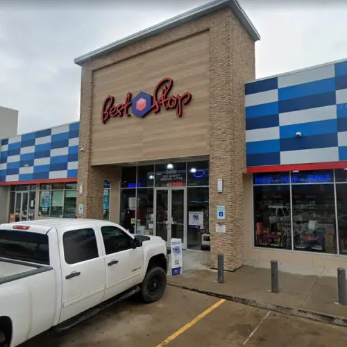Best Stop storefront with parked white truck