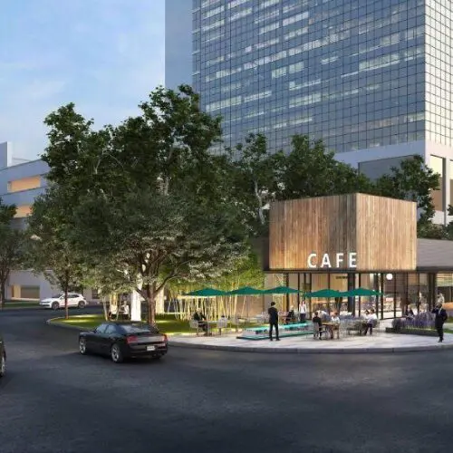 Urban outdoor cafe with seating and high-rise